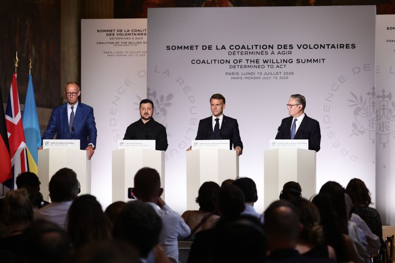 ap_6a559e1be3e94-1783995931 From left, German Chancellor Friedrich Merz, Ukrainian President Volodymyr Zelensky, French President Emmanuel Macron, and British Prime Minister Keir Starmer address a press conference after the Coalition of the Willing summit on security guarantees for Ukraine in Paris, Monday, July 13, 2026. (Teresa Suarez/Pool Photo via AP)
