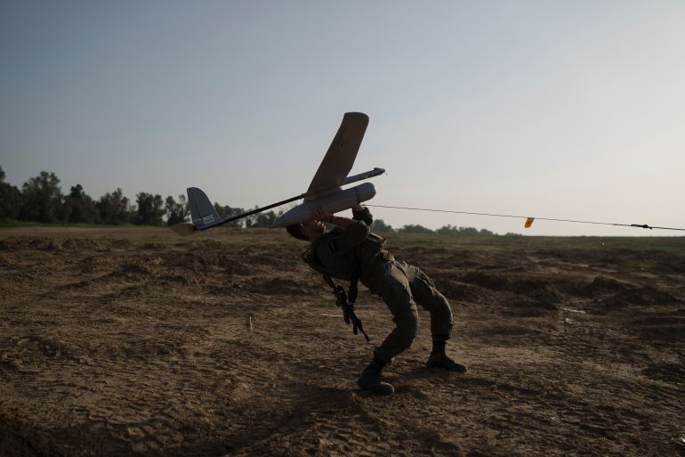 An Israeli soldier launches a drone near the Israeli-Gaza border, southern Israel, Tuesday, Jan. 9, 2024. (AP Photo/Leo Correa)