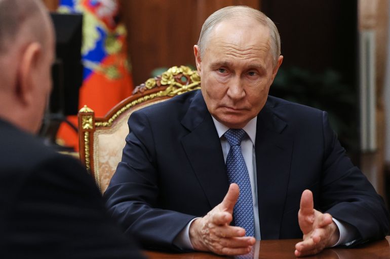 ap_6a5bc59b07c38-1784399259 Russian President Vladimir Putin, right, gestures while speaking to Norilsk Nickel CEO Vladimir Potanin, back to a camera, at the Kremlin in Moscow, Wednesday, July 15, 2026. (Gavriil Grigorov/Sputnik, Kremlin Pool Photo via AP)