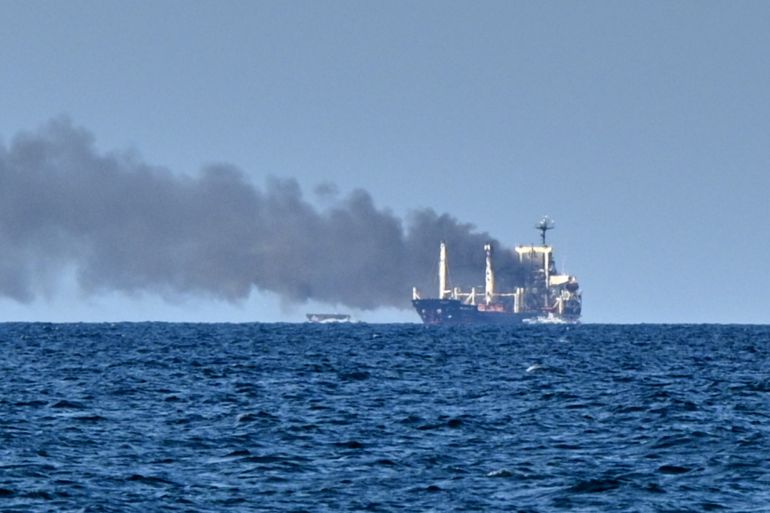 ap_6a5d526487d2c-1784500836-1 Smoke rises from the grain carrier Golden Leo under the Guinea-Bissau flag after Russian missile strike in the Black Sea close to Odesa, Ukraine, Sunday, July 19, 2026, local media reports. (AP Photo/Michael Shtekel)