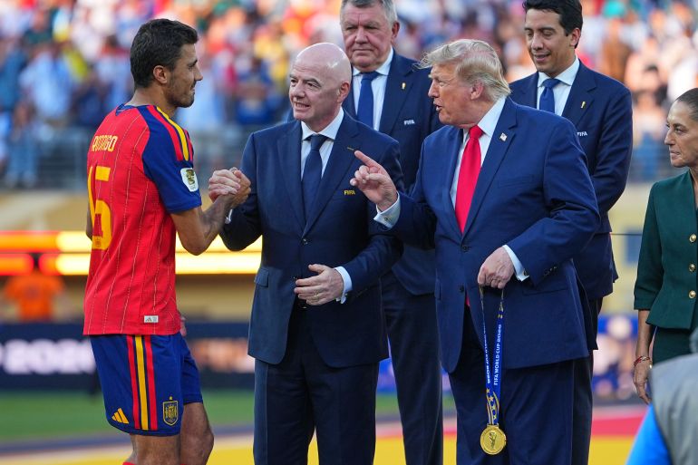 ap_6a5e57ec5ba7b-1784567788 Spain's Rodri (16) is greeted by FIFA President Gianni Infantino and President Donald J. Trump during the presentation ceremony after the World Cup final soccer match between Spain and Argentina in East Rutherford, N.J., near New York, Sunday, July 19, 2026. (AP Photo/Julio Cortez)