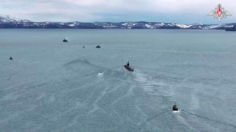 ap_6a61a11612351-1784783126 In this image made from video provided by Russian Defense Ministry Press Service on Thursday, May 21, 2026, A Russian nuclear submarine escorted by boats is seen during drills of Russia's nuclear forces. (Russian Defense Ministry Press Service via AP)