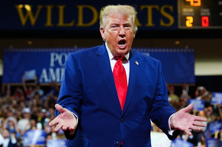 ap_6a62525a208fb-1784828506 President Donald Trump gestures as he arrives to speak at Wheeler High School, Wednesday, July 22, 2026, in Marietta, Ga. (AP Photo/Julia Demaree Nikhinson)