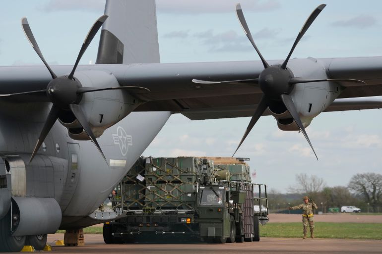 ap_6a626a711d77d-1784834673 Munitions are unloaded from a cargo plane on the apron at RAF Fairford, England, Thursday, March 26, 2026. (AP Photo/Alastair Grant)