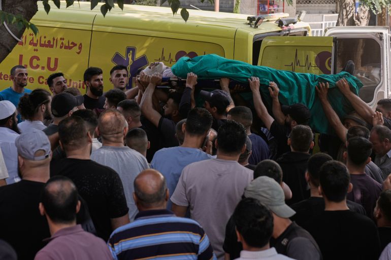 ap_6a633b7a0d112-1784888186 People carry the body of a Palestinian who, according to the Palestinian Health Ministry, was killed by Israeli forces near the village of Tell, after his body was brought to Nablus Speciality Hospital in the West Bank city of Nablus, Friday, July 24, 2026. (AP Photo/Majdi Mohammed)