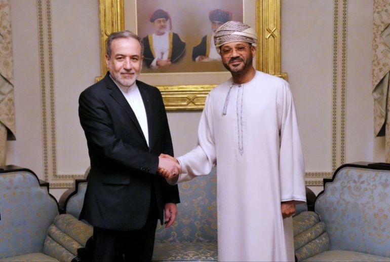 ap_6a63bc5070133-1784921168 In this photo released by the Iranian Foreign Ministry, Iranian Foreign Minister Abbas Araghchi, left, shakes hands with his Omani counterpart Sayyid Badr Albusaidi during their meeting prior to Iran and the U.S. negotiations, in Muscat, Oman, Friday, Feb. 6, 2026. (Iranian Foreign Ministry via AP)