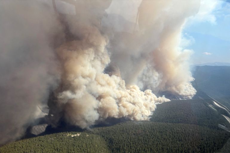 canda-2-1784584541 Smoke rises from the French Bar Creek wildfire (K70748) northwest of Cache Creek, British Columbia, Canada, July 17, 2026, in an aerial photograph taken with a mobile phone and taken through a window. BC Wildfire/Handout via REUTERS. THIS IMAGE HAS BEEN SUPPLIED BY A THIRD PARTY.