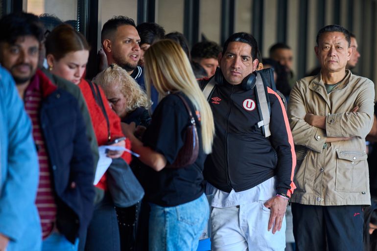 Immigrants queue to request public transport certificate, which will allow them to apply for fast-track work and residency permits as part of the Spanish government's amnesty measure, paving the way for hundreds of thousands of immigrants to obtain legal status, in Madrid, Spain, Thursday, April 16, 2026. (AP Photo/Manu Fernandez)