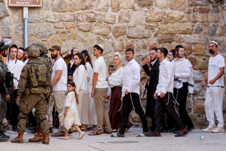 Israeli settlers take part in a weekly tour in Hebron, in the Israeli-occupied West Bank, June 27, 2026. REUTERS/Mussa Qawasma