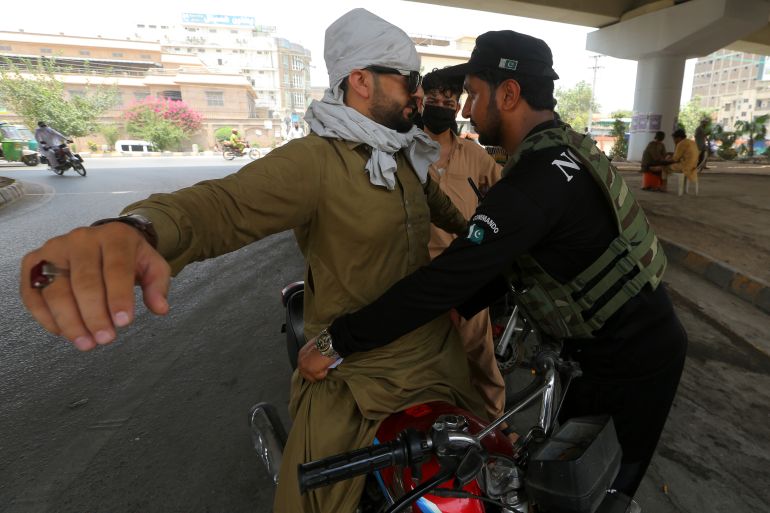 epa_6a5a39314db9-1784297777 epaselect epa13074871 Pakistani security officials check people on a roadside in the provincial capital of Khyber Pakhtunkhwa (KPK) Province, which borders Afghanistan, in Peshawar, Pakistan, 30 June 2026. Pakistan on 29 June carried out airstrikes and launched a cross-border ground operation in eastern Afghanistan, saying the action targeted militant hideouts in the border provinces of Paktia, Paktika and Kunar following recent attacks inside Pakistan. According to Afghan government Deputy Spokesperson Hamdullah Fitrat, at least 36 people were killed and more than 163 were injured in the attack. EPA/BILAWAL ARBAB