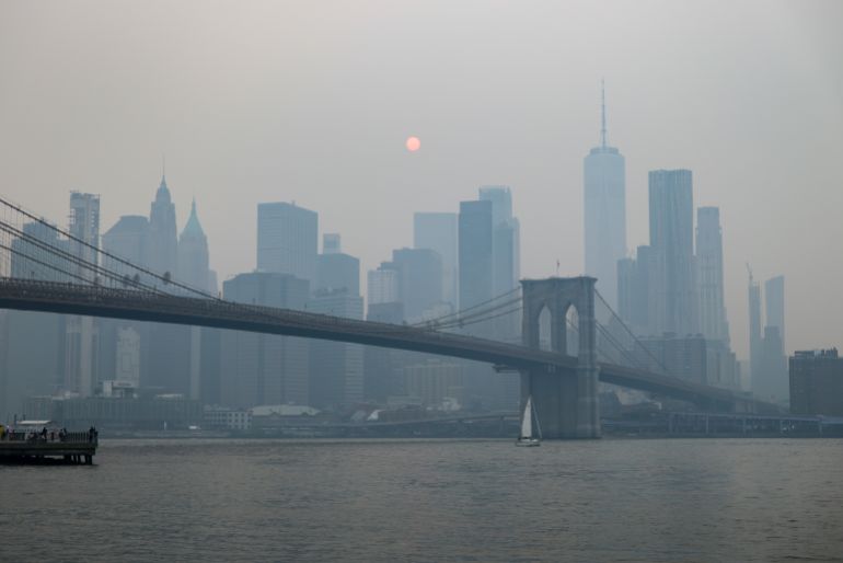 epa_6a5cc98f41d8-1784465807 epa13116413 Wildfire smoke is seen amongst the Manhattan skyline and Brooklyn Bridge from the Brooklyn Promenade in the Brooklyn borough of New York, New York, USA, 16 July 2026. The National Weather Service has issued an Air Quality Alert until the end of the day on 16 July in New York due to smoke from wildfires in Canada affecting air quality in several US states. EPA/CHRISTOPHER NEUNDORF