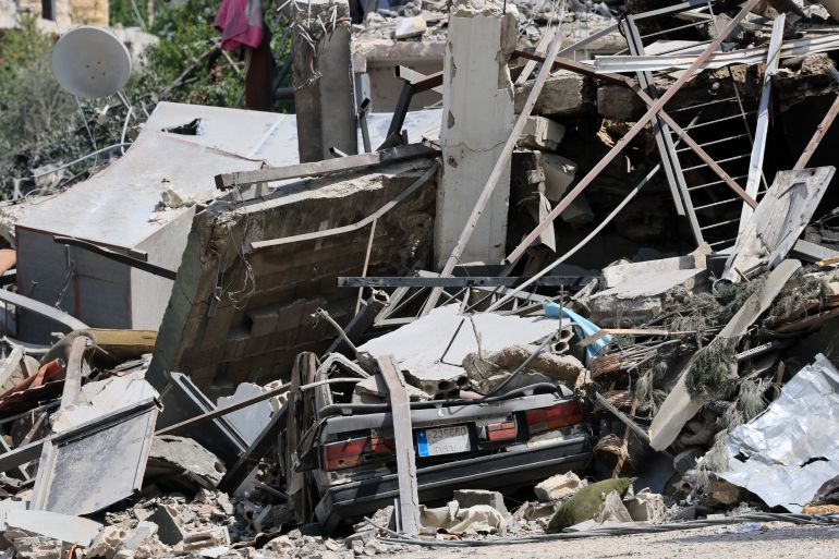 epa13058693 A view of a destroyed building and a car targeted by an Israeli air strike in the village of Zawtar al-Gharbiyah, southern Lebanon, 23 June 2026, amid a ceasefire between Israel and Hezbollah. A comprehensive joint report by the United Nations Development Programme (UNDP) and the Lebanese National Council for Scientific Research (CNRS-L) estimated direct building damage in South Lebanon at 1.38 billion US dollar. The assessment found over 11,000 buildings completely destroyed and 3.1 million cubic meters of debris, structurally affecting more than 41,000 housing units. EPA/WAEL HAMZEH