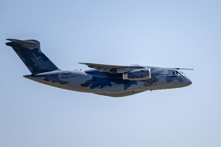 epa_6a6227e4ac0f-1784817636 epa13115389 A C-390 Millennium military transport aircraft made by Brazilian aerospace manufacturer Embraer flies over during the ceremonial handover to the Czech Army at Kbely military airport in Prague, Czech Republic, 16 July 2026. The Czech Armed Forces officially received the first of two Embraer C-390 Millennium military transport aircraft. The aircraft can transport troops and heavy military equipment and can also be used for firefighting and medical evacuation missions. EPA/MARTIN DIVISEK