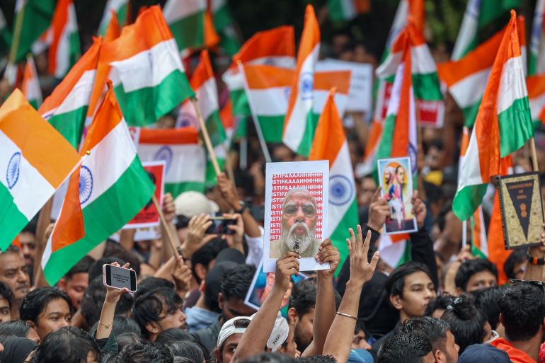 epa_6a66a5088b9e-1785111816 epa13133532 Supporters of the youth-led satirical political movement Cockroach Janta Party (CJP) celebrate the resignation of Union Education Minister Dharmendra Pradhan, in Mumbai, India, 26 July 2026. Pradhan tendered his resignation on 25 July following nationwide student protests over examination paper leaks. EPA/DIVYAKANT SOLANKI