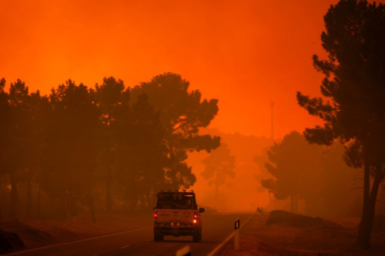 epa_6a6b922a4a8f-1785434666 epa13140502 A forest firefighter vehicle drives during a wildfire that started in Valpacos and is now raging in the villages of Fradizela, Mirandela municipality, Portugal, 29 July 2026. EPA/PEDRO SARMENTO COSTA