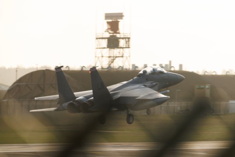LAKENHEATH, ENGLAND - JANUARY 07: An F15 fighter plane comes in to land at RAF Lakenheath at sunset on January 07, 2026 in Mildenhall, England. There have been recent reports of increased United States Air Force aircraft arriving at American bases in England this week, including RAF Fairford in Gloucestershire and at RAF Mildenhall in Suffolk. The reports coincide with today’s US seizure of the Marinera (previously called the Bella-1), a Russian-flagged tanker in the North Atlantic, and against the backdrop of statements from US officials, including the president, vowing to acquire Greenland, a self-governed territory of Denmark, a NATO member. (Photo by Dan Kitwood/Getty Images)