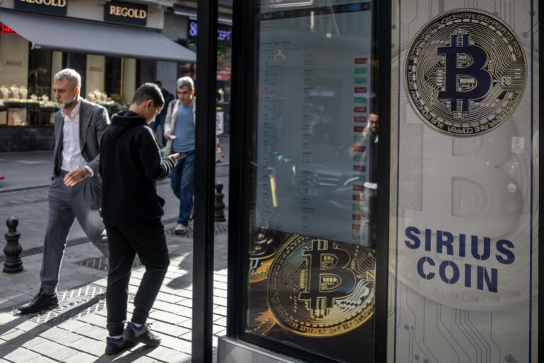 getty_69ef153f7a-1777276223 ISTANBUL, TURKEY - NOVEMBER 08: People walk past a Bitcoin sign at the entrance of a cryptocurrency exchange office on November 08, 2024 in Istanbul, Turkey. Bitcoin has soared to new record highs nearing 77,000 in the days after Donald Trump's re-election and on his campaign promise to support Bitcoin and the cryptocurrency market. (Photo by Chris McGrath/Getty Images)