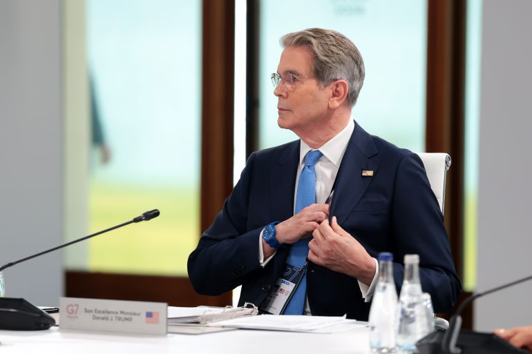 getty_6a32a8859e-1781704837 EVIAN-LES-BAINS, FRANCE - JUNE 17: US Secretary of the Treasury Scott Bessent sits in a chair reserved for U.S. President Donald Trump ahead of a working session on promoting economic growth with G7 leaders and G7 outreach partners, during the G7 Summit on June 17, 2026 in Evian-les-Bains, France. Leaders from the Group of 7 (G7) countries convened in Evian, France, near the Swiss border, for their annual summit to discuss challenges to peace and security for Ukraine and Europe, the situation in the Middle East, and other geopolitical issues. (Photo by Anna Moneymaker/Getty Images)