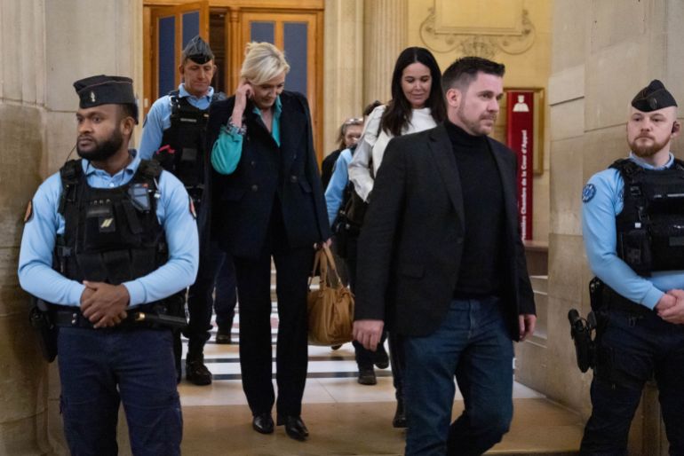 getty_6a4d13948b-1783436180 PARIS, FRANCE - FEBRUARY 10: Marine Le Pen, former president of the National Rally, walks next Catherine Griset (R), European Parliament Member, during a trial at the Palais de Justice on February 10, 2026 in Paris, France. The right-wing politician is appealing a five-year ban on running for office after being found guilty of embezzling European parliament funds. The trial is to conclude this week and a panel of judges is expected to issue a verdict before the summer. (Photo by Tom Nicholson/Getty Images)
