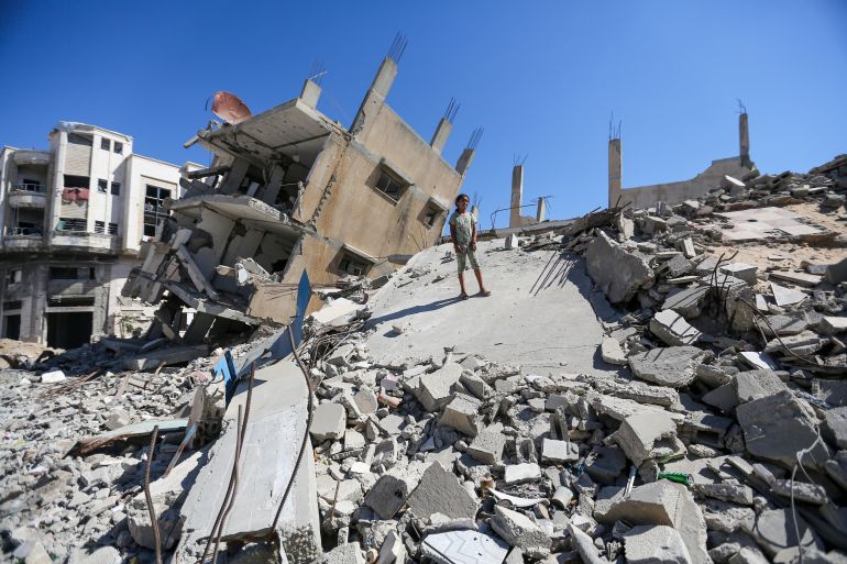 getty_6a4e17d374-1783502803 GAZA CITY, GAZA - JULY 2: A displaced Palestinian girl stands atop buildings destroyed by Israeli airstrikes on July 2, 2026 in Gaza City, Gaza. One thousand days have passed since the Oct. 7, 2023 Hamas-led attacks on southern Israel that sparked a brutal campaign of retribution across the Gaza Strip. A ceasefire was agreed to between Israel and Hamas last October, but Israel has continued periodic bombing in the territory. (Photo by Ahmad Hasaballah/Getty Images)