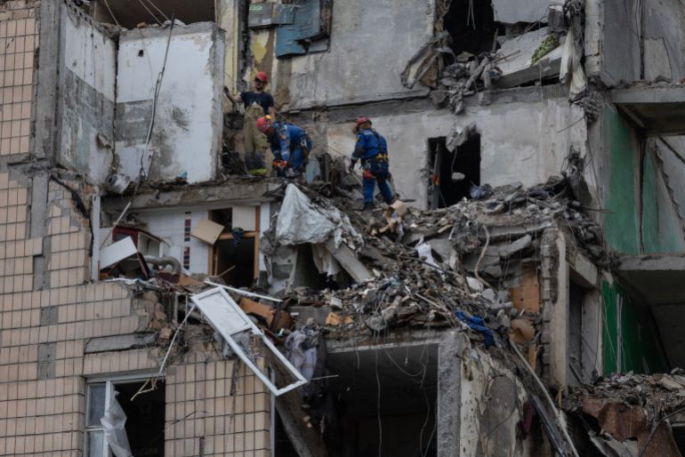 getty_6a50d73882-1783682872 KYIV, UKRAINE - JULY 06: Emergency workers and machinery clear debris from the scene of an attack as Russian missiles and drones struck Kyiv overnight killing at least 15 people on July 6, 2026 in Kyiv, Ukraine. At least 15 people were killed and dozens injured after a Russian attack hit multiple apartment blocks, in the second large attack in Kyiv within a week. (Photo by Paula Bronstein/Getty Images)