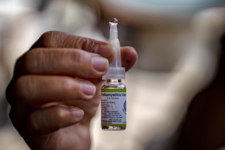 getty_6a5754932b-1784108179 MANILA, PHILIPPINES - OCTOBER 14: A community health worker shows a vial of an oral polio vaccine, during a mass vaccination campaign to combat the resurgence of the polio virus, at a slum area on October 14, 2019 in Manila, Philippines. The Philippines is aiming to vaccinate over 9 million children after the country's health department announced an outbreak of polio, 19 years after the World Health Organization declared the country free of the infectious disease. Health Secretary Francisco Duque has blamed poor immunization coverage and lack of proper sanitation and hygiene as the cause of the resurgence of the disease. The Philippines has been struggling to regain the publics trust in vaccines since 2017, when it was discovered that a dengue vaccine manufactured by French firm Sanofi could cause health risks to people who had not previously had the disease. Recently, the country declared a dengue epidemic after hundreds have died of the mosquito-borne disease. (Photo by Ezra Acayan/Getty Images)