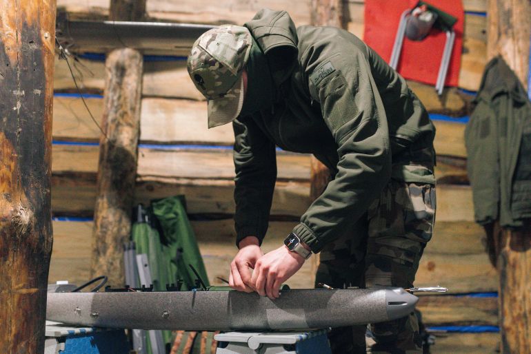 KHARKIV REGION, UKRAINE - APRIL 7: A soldier from the 'Taifun' unmanned aerial vehicle unit is assembling a new model of the 'Marsianin' drone in a dugout on April 7, 2026 in Kharkiv region, Ukraine. After years of developing systems and know-how to fend off Russia's drone attacks, Ukraine is now offering its hard-won expertise and counter-drone technology to other countries. In recent weeks, Ukrainian President Volodymyr Zelensky has been visiting Gulf states who are confronting a wave of relatively cheap kamikaze drones launched by Iran as it lashes out neighboring countries after the joint U.S.-Israeli attack. (Photo by Nikoletta Stoyanova/Getty Images)
