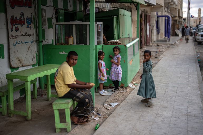 getty_6a58ff487a-1784217416 SOCOTRA ISLAND, YEMEN - OCTOBER 16: Children react to the camera as they wait by a shop in the main town of Hadibu on October 16, 2025 in Socotra, Yemen. Socotra, the largest island in an eponymous archipelago, lies 150 miles off the Horn of Africa, and even farther from mainland Yemen. Its relative isolation has mitigated the impact of Yemen's long-running and stalemated civil war, rendering it safe enough to attract a small but steady stream of foreign tourists. However, it has not been untouched by regional hostilities. In recent years, the UAE-backed secessionist group Southern Transitional Council wrested control of the island from the Saudi-backed internationally recognized government. The STC ultimately joined the government's Presidential Leadership Council, but the UAE retains considerable military and economic influence in the archipelago. (Photo by Carl Court/Getty Images)