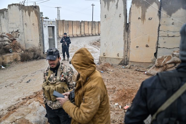getty_6a5b7c14db-1784380436 RAQQA, SYRIA - JANUARY 23: Members of Syrian government takeover the Al-Aqtan prison after Kurdish-led Syrian Democratic Forces (SDF) forces withdraw from al-Aqtan prison, bound for Kobani, on the outskirts of the northeastern Syrian city of Raqqa on January 23, 2026. Syrian government forces continue to retake large parts of northern and eastern Syria from Kurdish forces in a rapid push that has brought nearly all of Syria under the control of Damascus and government forces. the United States said it launched an operation Wednesday that could move thousands of Islamic State group jihadists from Syria to Iraq. (Photo by Abdulmonam Eassa/Getty Images)