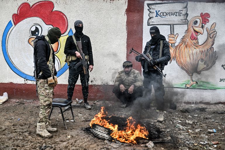 getty_6a5b7f3a65-1784381242 RAQQA, SYRIA - JANUARY 23: Members of Syrian government forces takeove Al-Aqtan prison after Kurdish-led Syrian Democratic Forces (SDF) forces withdraw from al-Aqtan prison, on January 23, 2026 in Raqqa, Syria. Syrian government forces continue to retake large parts of northern and eastern Syria from Kurdish forces in a rapid push that has brought nearly all of Syria under the control of Damascus and government forces. (Photo by Abdulmonam Eassa/Getty Images)