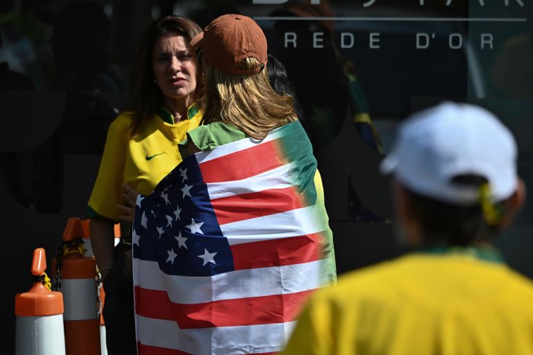 getty_6a655e7878-1785028216 BRASILIA, BRAZIL - SEPTEMBER 14: Supporters of former President Jair Bolsonaro gather in front of DF Star Hospital to show their support during surgery to remove skin blemishes on September 14, 2025 in Brasilia, Brazil. Bolsonaro ruled the country from 2019 to 2022 and has been sentenced to 27 years in prison over a coup plot following his defeat by Lula da Silva in the 2022 presidential election. The right-wing former president also faces four additional charges related to attacks on the democratic order. (Photo by Ton Molina/Getty Images)