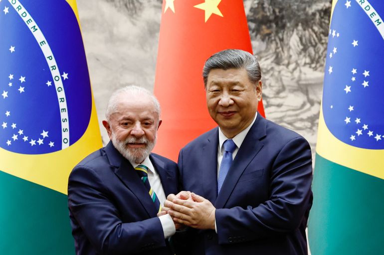BEIJING, CHINA - MAY 13: Chinese President Xi Jinping shakes hands with Brazil's President Luiz Inacio Lula da Silva after a signing ceremony and a joint press conference, at the Great Hall of the People on May 13, 2025 in Beijing, China. The summit includes China's key Latin American trade partners, and comes as Beijing and Washington work on defusing a trade war. (Photo by Tingshu Wang - Pool/Getty Images)