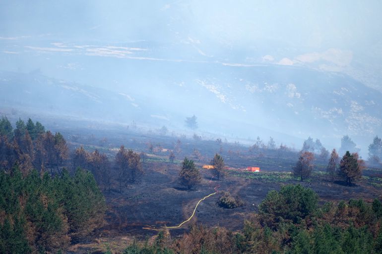 GLOSSOP, ENGLAND - JULY 13: Smoke rises from a wildfire on July 13, 2026 near Glossop, England. A major incident has been declared on between Tintwistle Moor in Glossop, Derbyshire and Dovecote Reservoir as high winds and a severe heatwave caused a wildfire, which originally broke out on 24 June, to flare up. (Photo by Christopher Furlong/Getty Images)