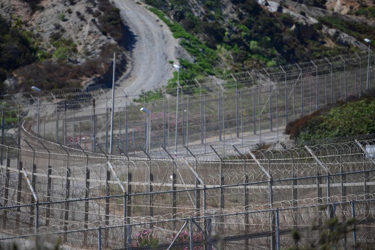 CEUTA, SPAIN - AUGUST 23: General view of the border fence separating the Spanish exclave of Ceuta from Morocco on August 23, 2018 in Ceuta, Spain. Many migrants are seeking to reach Europe through Ceuta and a second Spanish exclave, Melilla, as the migrant route has shifted towards the western Mediterranean and away from the Balkans. Yesterday morning 150 African migrants jumped the fence from Morocco. (Photo by Alexander Koerner/Getty Images)