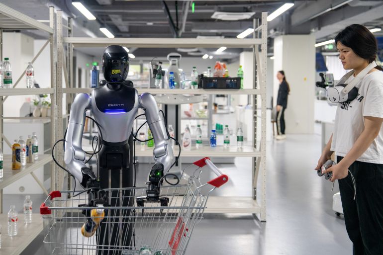 HEFEI, CHINA - JUNE 3, 2026 - A staff member was conducting shelf retrieval training for robots at the data collection training ground for embodied intelligent robots in Yaohai District, Hefei City, Anhui Province, China on June 3, 2026. (Photo credit should read CFOTO/Future Publishing via Getty Images)