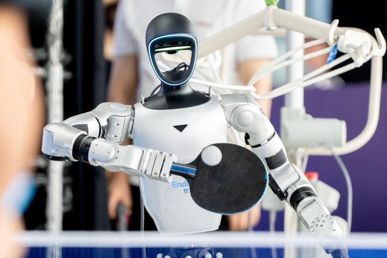 HANGZHOU, CHINA - JUNE 29: A robot trains in table tennis at Hangzhou Robot School on June 29, 2026 in Hangzhou, Zhejiang Province of China. The school offers four programs - technical, nursing, arts and sports - providing all-around training in robots' capabilities, from ethics and safety, perception and motion performance to aesthetic expression and hands-on scenario operation. (Photo by VCG/VCG via Getty Images)