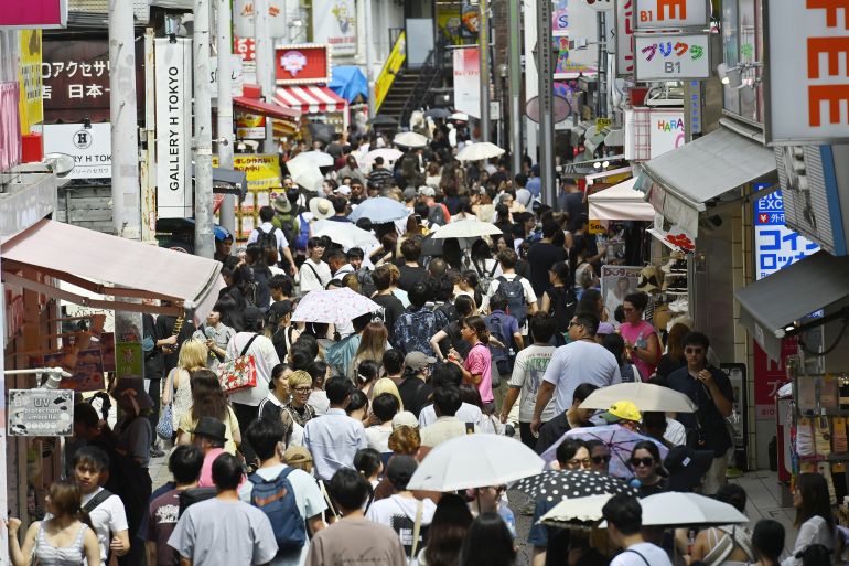 gettyimages-2285404987-1784029663 TOKYO, JAPAN - JULY 14 : Pedestrians and tourists crowd Takeshita Street in Tokyo's Harajuku district during hot weather in Tokyo, Japan, July 14, 2026. A high-pressure system brought intense heat to eastern Japan, with temperatures in central Tokyo forecast to reach 34 degrees Celsius. (Photo by David Mareuil/Anadolu via Getty Images)