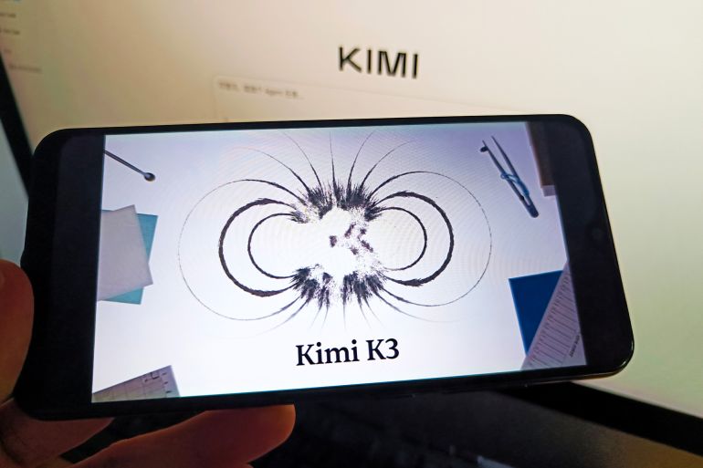 gfjh65-1784370959 SUQIAN, CHINA - JULY 17, 2026 - A netizen is using his mobilephone to view Kimi K3 logo and using his computer to view Kimi K3 webpage in Suqian, Jiangsu, China on July 17, 2026. (Photo credit should read CFOTO/Future Publishing via Getty Images)