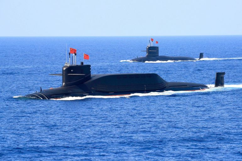 reuters_69ce48b9-1775126713 A nuclear-powered Type 094A Jin-class ballistic missile submarine of the Chinese People's Liberation Army (PLA) Navy in waters during a military display in the South China Sea April 12, 2018. REUTERS/Stringer ATTENTION EDITORS - THIS IMAGE WAS PROVIDED BY A THIRD PARTY. CHINA OUT. NO COMMERCIAL OR EDITORIAL SALES IN CHINA./File Photo To Match CHINA-MILITARY/OCEAN-MAPPING