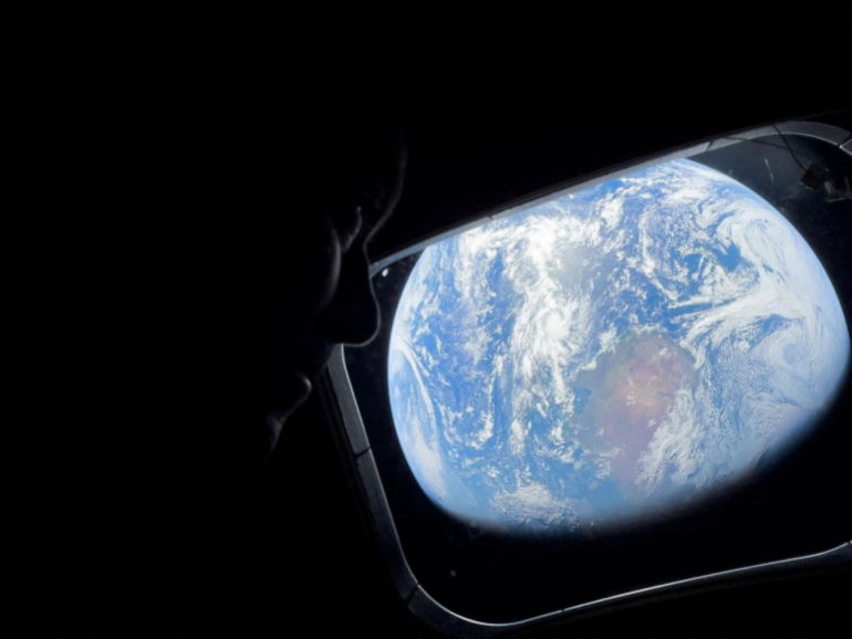 reuters_69d9b0d6-1775874262 NASA astronaut and Artemis II Commander Reid Wiseman peers out of one of the Orion spacecraft's main cabin windows, looking back at Earth, as the crew travels towards the Moon April 2, 2026. NASA/Handout via REUTERS. THIS IMAGE HAS BEEN SUPPLIED BY A THIRD PARTY. REFILE - CORRECTING YEAR FROM "2024" TO "2026".