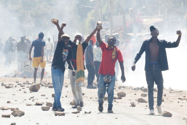 Demonstrators react as they gather along a street in a protest against a U.S.-backed Ebola quarantine plan to establish a 50-bed facility at a Kenyan air force base intended to host Americans exposed to Ebola, in Nanyuki town, Laikipia County, Kenya, June 9, 2026. REUTERS/Monicah Mwangi TPX IMAGES OF THE DAY