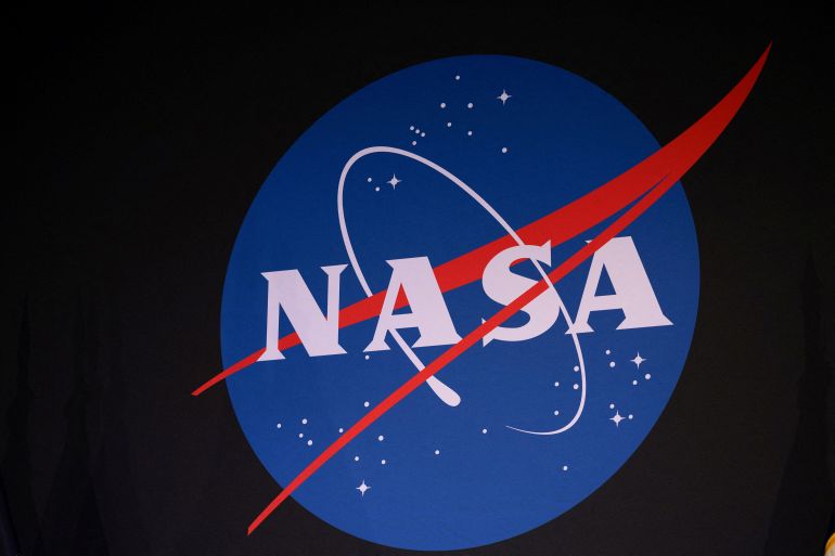 reuters_6a4490b9-1782878393 FILE PHOTO: The NASA logo during the unveiling for the NASA Artemis III mission at an event at NASA Johnson Space Center in Houston, Texas, U.S., June 9, 2026. REUTERS/Antranik Tavitian/File Photo