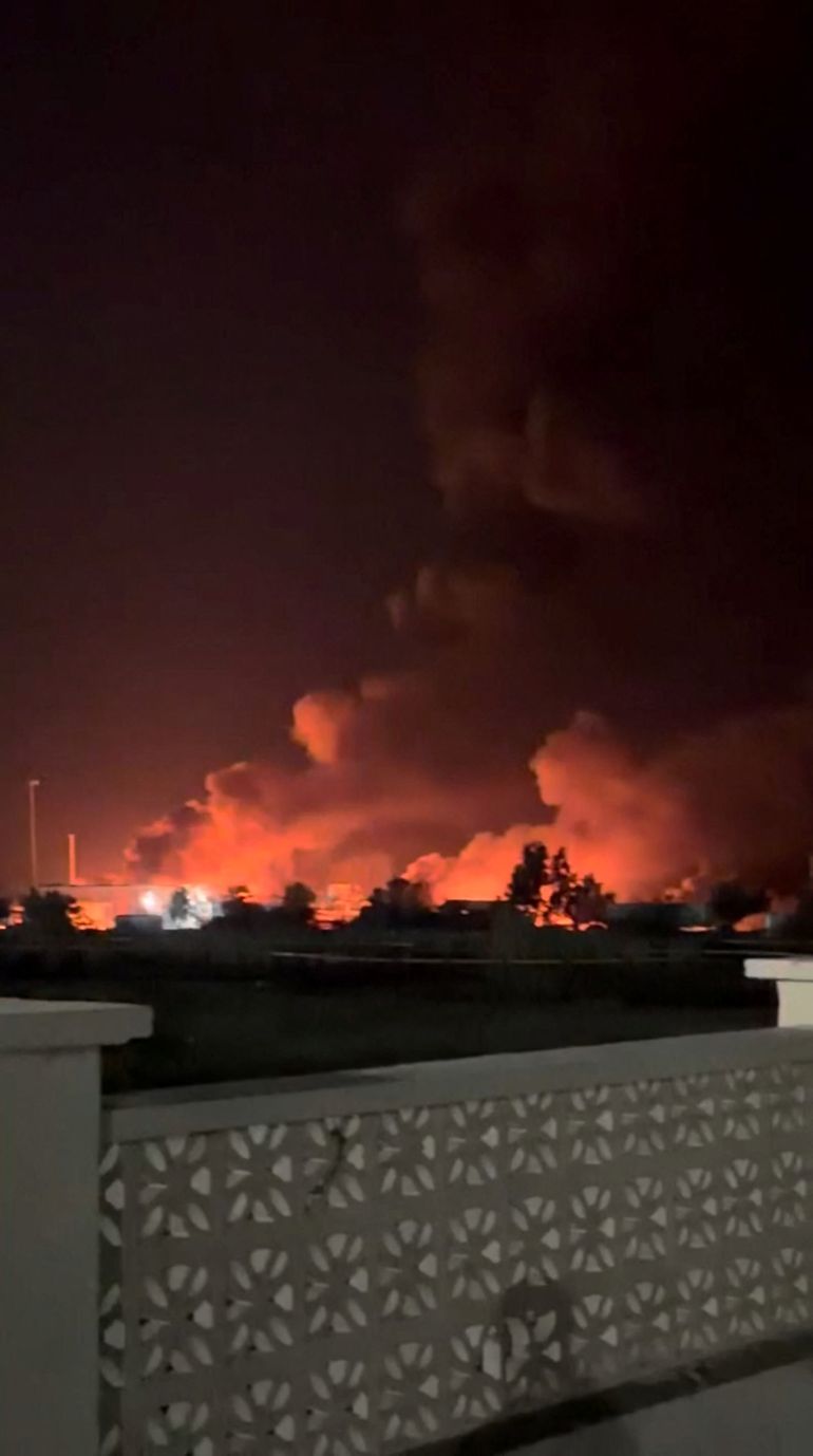 reuters_6a4ea7dc-1783539676 Smoke rises from a port, near Strait of Hormuz, following a U.S. strike in Kuhestak, Hormozgan Province, Iran, July 8, 2026, in this screengrab obtained from a social media video. Social Media/via REUTERS THIS IMAGE HAS BEEN SUPPLIED BY A THIRD PARTY. MANDATORY CREDIT. NO RESALES. NO ARCHIVES. NEWS USE ONLY. Verification line: Reuters confirmed the location by matching the port layout visible in the video with satellite imagery. The coordinates are 26.801109802855272, 57.02121784040872. The date the video was filmed was verified through a report from Iran’s semi-official Mehr News Agency, which reported explosions early on July 8 at multiple locations along the Gulf coast, including Kuhestak. Aftermath photographs shared online on July 8 also showed damage at the same location. No earlier versions of the footage or photographs posted before July 8 were found.