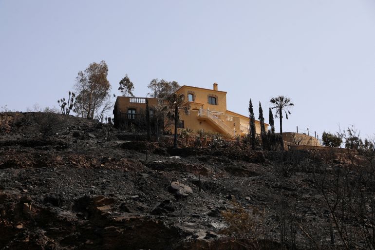 reuters_6a54f760-1783953248-1 A damaged house remains amidst a burned area following deadly wildfires affecting Almeria province, in Bedar, Almeria, Spain, July 11, 2026. REUTERS/Loyola Perez de Villegas Muniz TPX IMAGES OF THE DAY