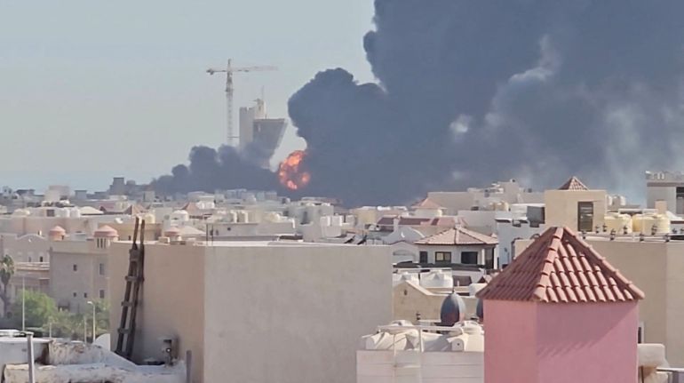 Smoke billows near the oil facility in Mangaf, Kuwait, July 18, 2026, in this screen grab obtained from a social media video. Social Media/via REUTERS THIS IMAGE HAS BEEN SUPPLIED BY A THIRD PARTY. MANDATORY CREDIT. NO RESALES. NO ARCHIVES. NEWS USE ONLY. Verification lines: - Tower, mosque, and buildings matched satellite and archive imagery. - Date verified by statement from Kuwait Petroleum Corporation that one of its oil facilities had been hit in "repeated Iranian attacks," causing significant damage and some injuries, according to the state news agency. - The area where the smoke is shown in the video is marked as a Kuwait Petroleum Company facility on Google maps.