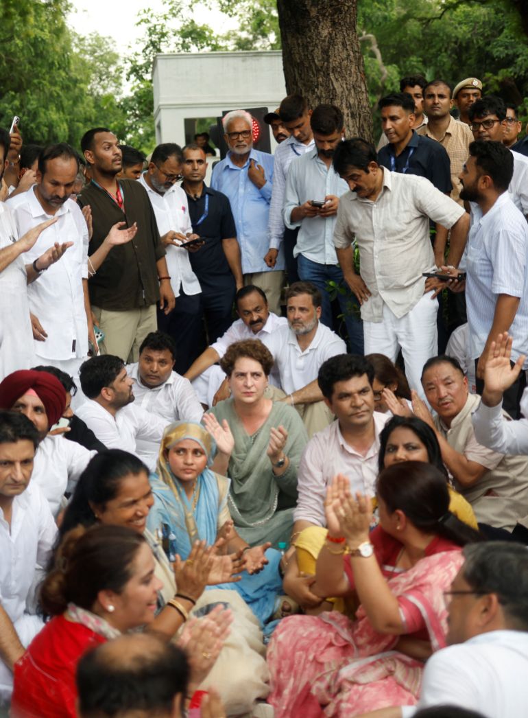 reuters_6a5fcbb5-1784662965 Indian opposition leaders Rahul Gandhi and his sister Priyanka Gandhi Vadra, along with members of their Congress party, sit in protest outside Prime Minister Narendra Modi's residence demanding accountability for police action against students, in New Delhi, India, July 21, 2026. REUTERS/Adnan Abidi