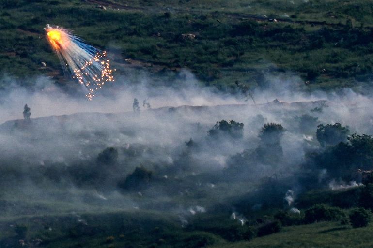 FILE PHOTO: An explosion of what appears to be white phosphorus fired by the Israeli military on the Lebanese side of the Israel-Lebanon border as seen from the Israeli side of the border, May 10, 2026. REUTERS/Ayal Margolin/File Photo ISRAEL OUT. NO COMMERCIAL OR EDITORIAL SALES IN ISRAEL