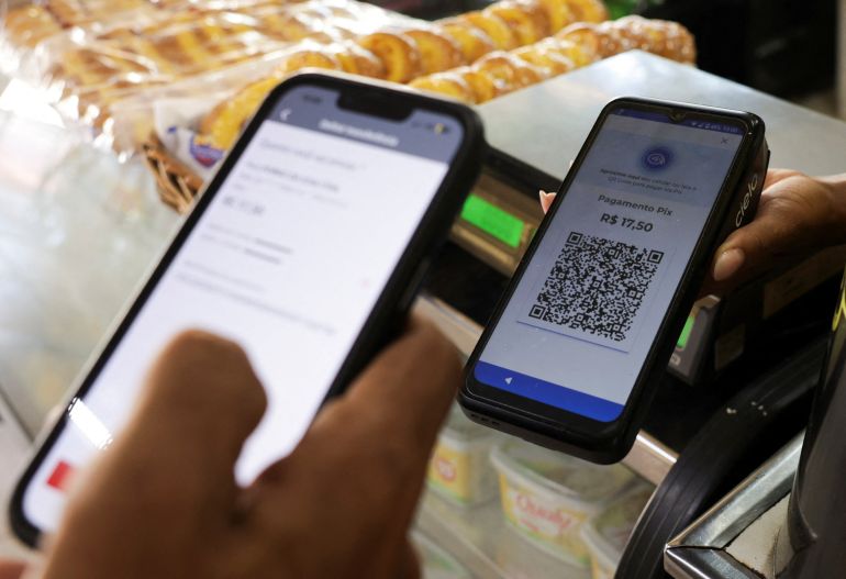A customer uses his phone to pay via Pix at a store in Rio de Janeiro, Brazil, July 21, 2026. REUTERS/Ricardo Moraes