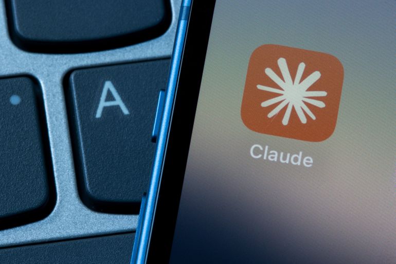shutterstock_2510007839-1732610011 Portland, OR, USA - Aug 30, 2024: Claude app icon is seen on an iPhone. Claude is a family of large language ...
