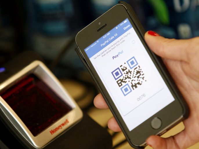 05b8c38f-5e55-406d-927b-2234c770f92e A PayPal employee demonstrates one of the company's options to pay with a mobile device at store within a PayPal office building in San Jose, California May 28, 2014. REUTERS/Beck Diefenbach (UNITED STATES - Tags: BUSINESS)